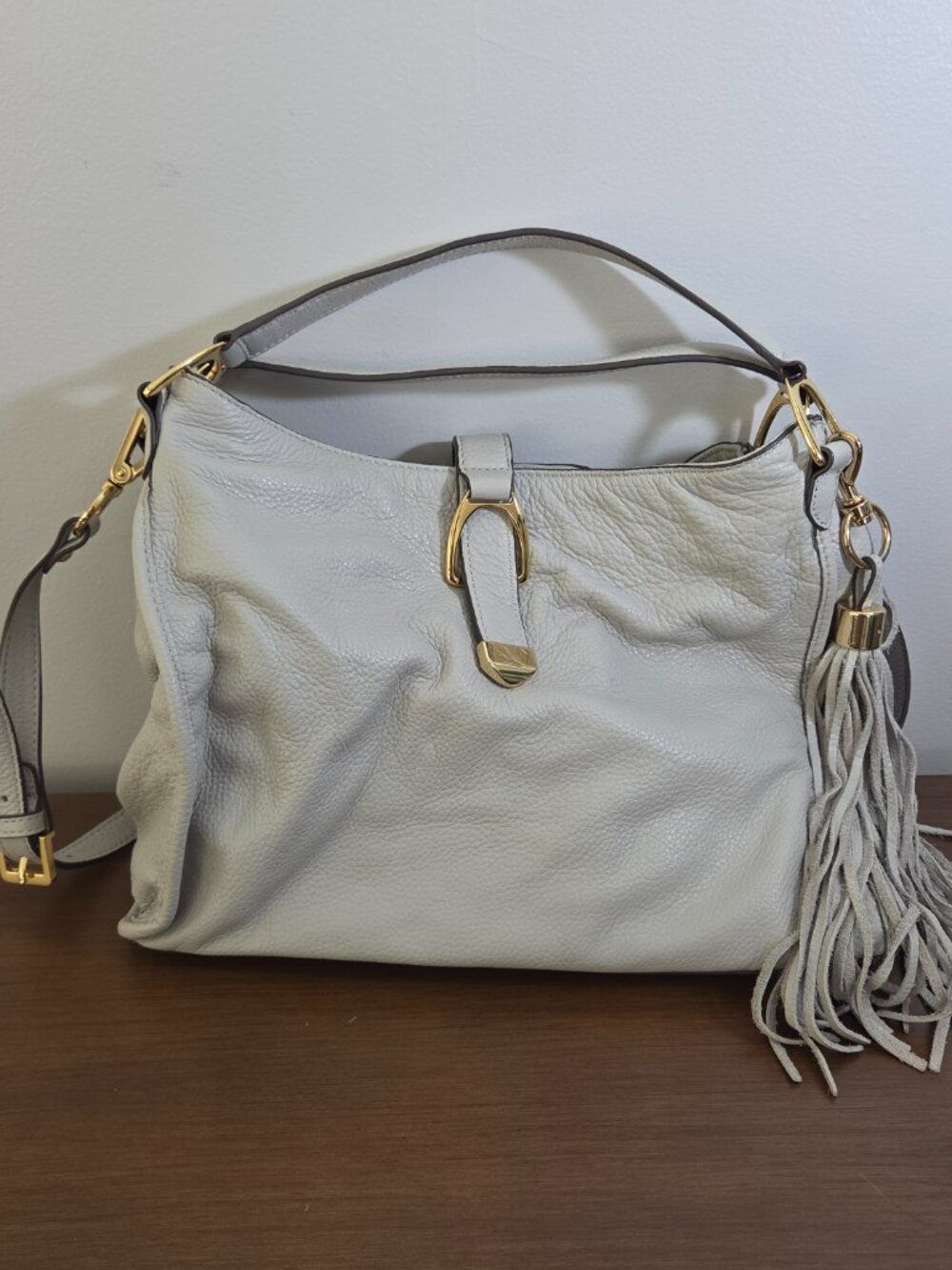 G.I.L.I LIGHT GRAY PEBBLED LEATHER STIRRUP HOBO SATCHEL WITH FRINGE TASSEL GOLD